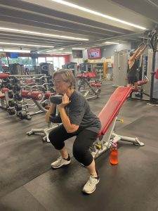 Lisa Buss at the gym and lifting.